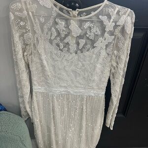 White beaded knee length dress